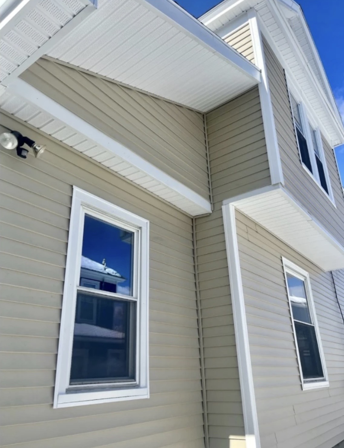 Standard double-4" clapboard with clean, crisp white trim